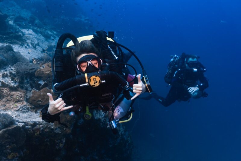 Female CCR diver looking into the camera lens.