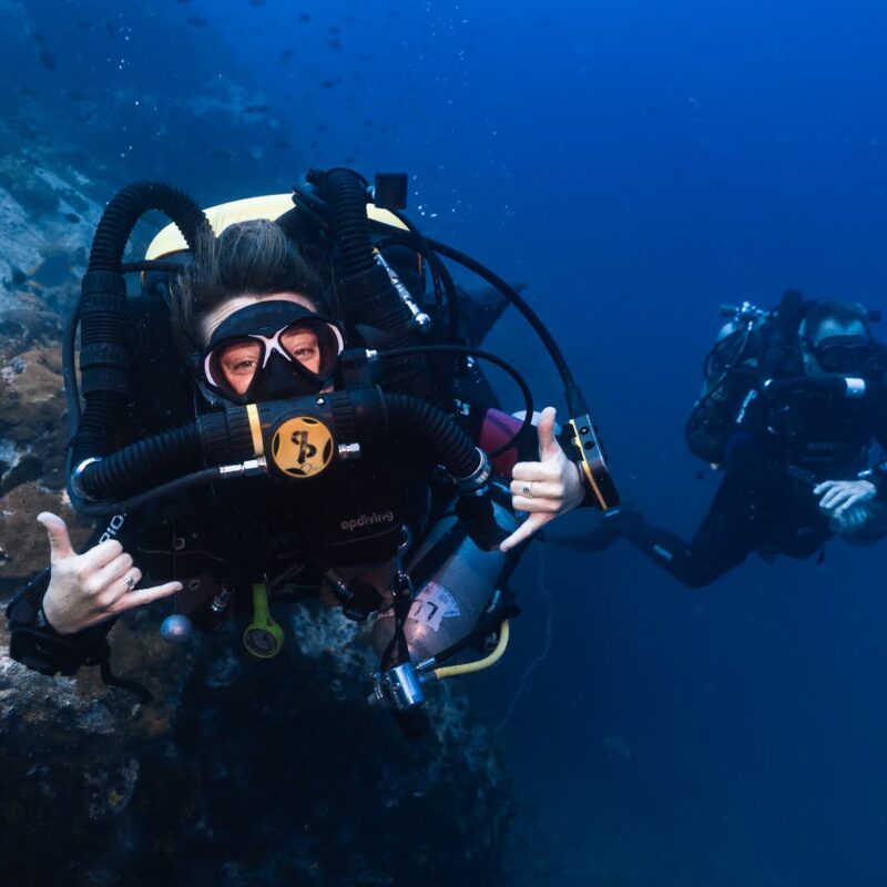 Female CCR diver looking into the camera lens.